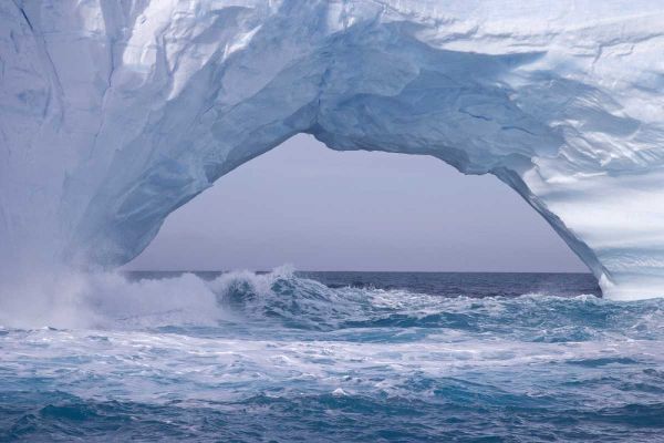 South Georgia Island Waves splash under iceberg